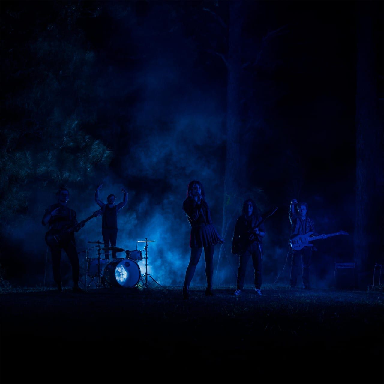 Darkmenia in dark forest with blue smoke – TSOE music video